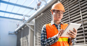 Man wearing hart hat at construction site